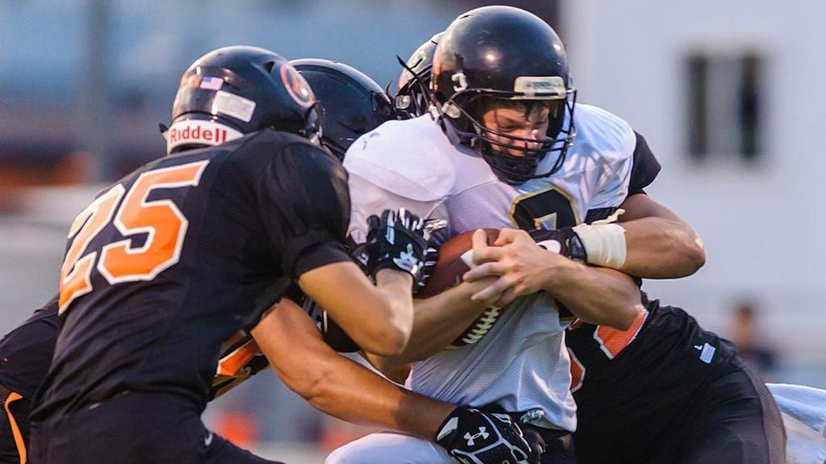 Meridian running back Bryce Vandenhaak wrapped up by a horde of Blaine defenders at the line of scrimmage during a Week 2 game Sept. 8.