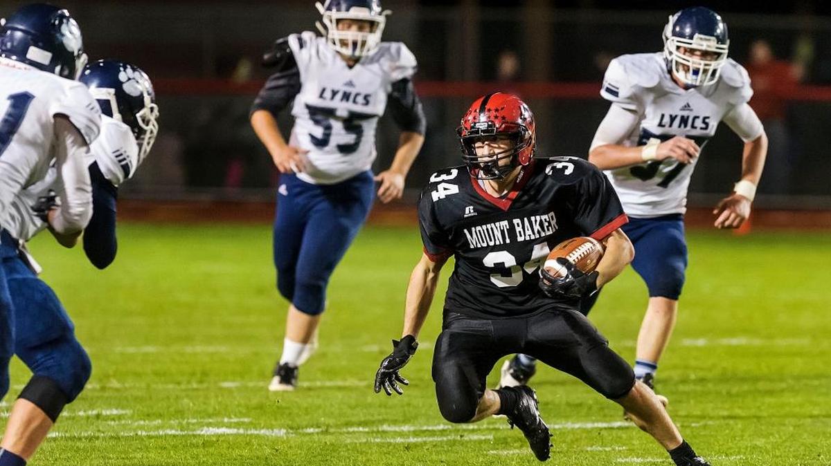 Mount Baker running back Sam Barrett looks for daylight against the Lynden Christian defense during the second quarter Friday, Sept. 29, in Deming.
