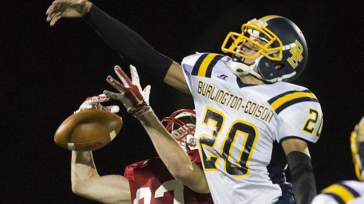 Burlington-Edison’s Jacob Zamora defends a pass to Bellingham’s Ethan Fields Saturday, Oct. 1, at Civic Stadium in Bellingham.