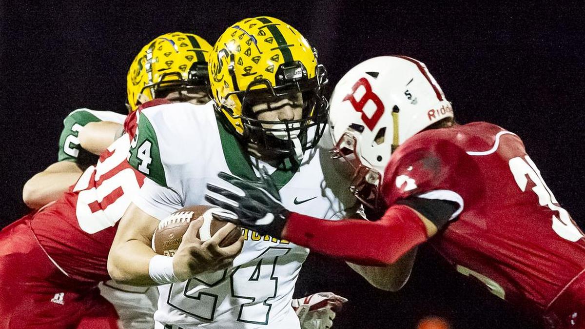 Running back Dylan Roberts, center, runs Oct. 19 when Sehome defeated Bellingham 54 to 27. The teams have a quick rematch in a Northwest District 2A opener Friday night at Civic Stadium.
