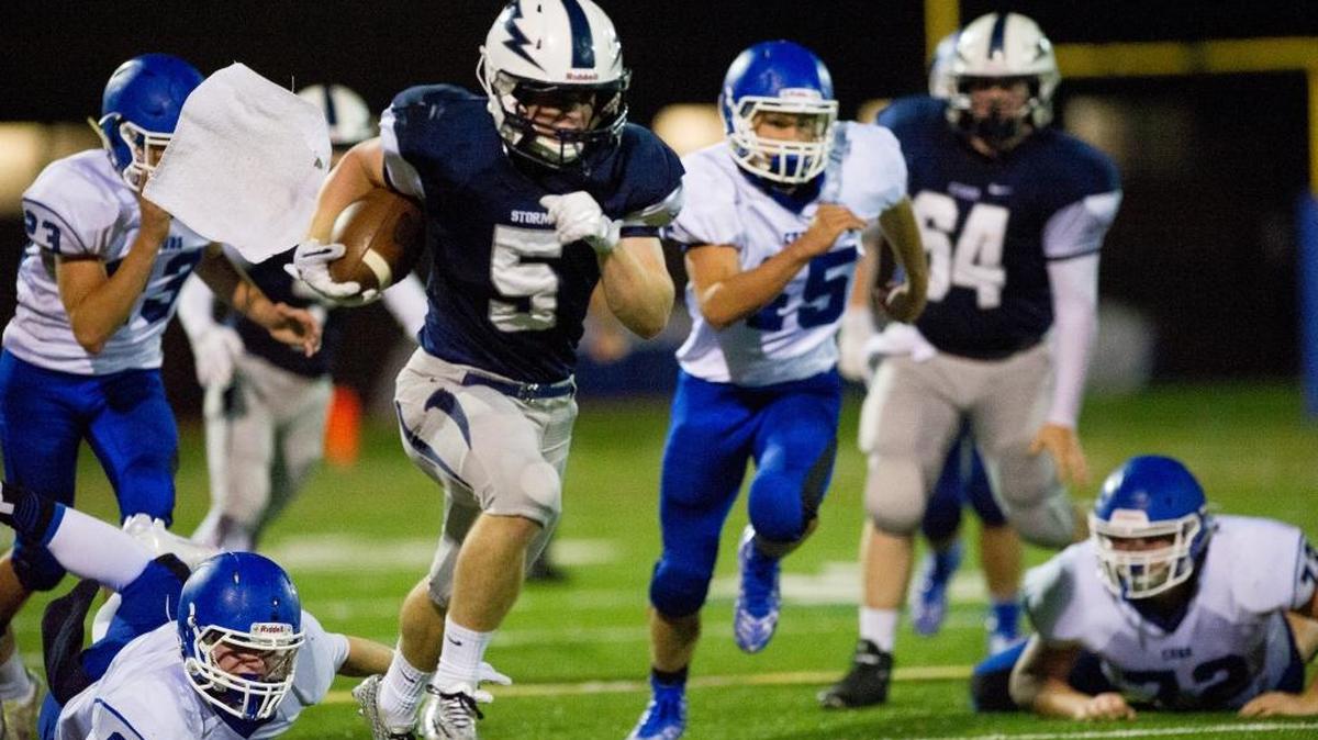 
Squalicum junior Ben Peterson (5) runs for a first down against Sedro-Woolley on Friday, Sept. 25, at Civic Stadium. 
