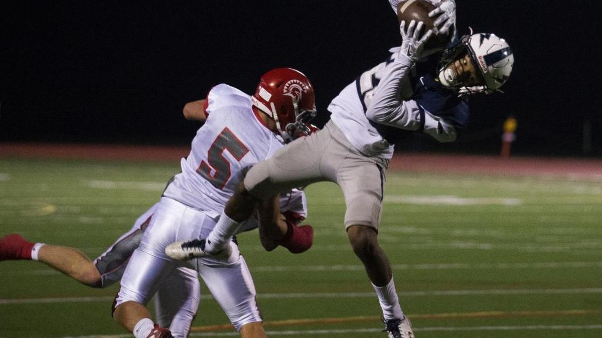 Squalicum's Ja’Lique Martin looks toward the goal line as he makes a reception against Stanwood on Saturday, Sept. 23, at Civic Stadium in Bellingham. Stanwood won 36-28.
