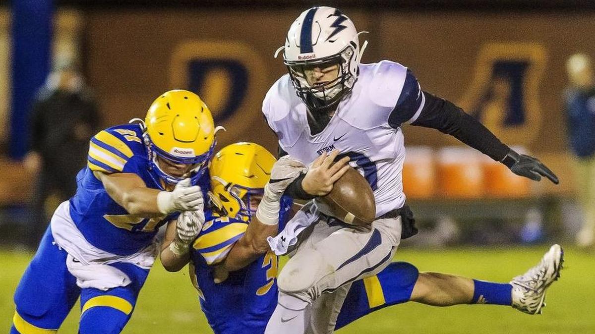 Squalicum’s Spencer Lloyd tries to avoid Ferndale defenders Cole Semu, left, and Carter Colon Friday, Oct. 20. The Storm plays Arlington Thursday at Civic Stadium.