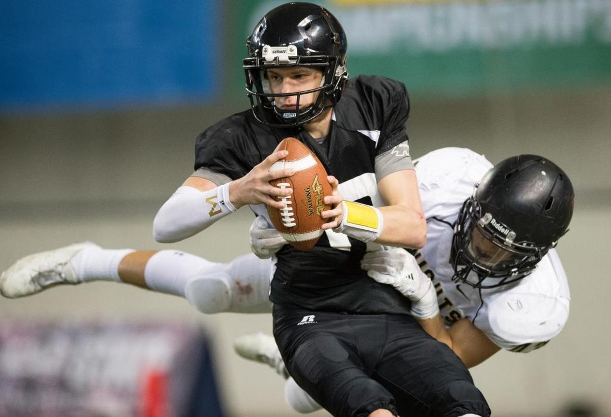 Meridian’s Simon Burkett is sacked by Royal’s Jack Diaz on third down with a little more than five minutes left in the game Saturday, Nov. 2, at the Tacoma Dome.
