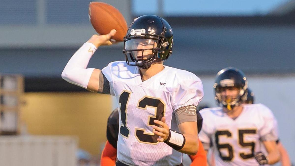 Meridian quarter back Simon Burkett looks for an open man during the second quarter Sept. 8 at Blaine High School.