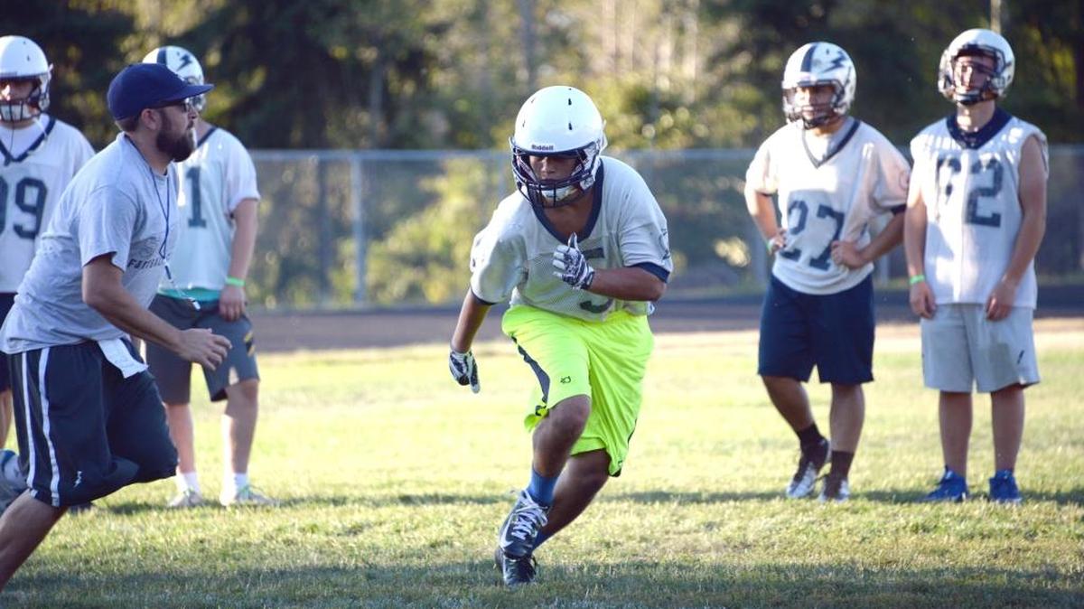 
Squalicum’s Creighton Kaui goes through linebacker drills during practice Wednesday, Aug. 19, at Squalicum High School
