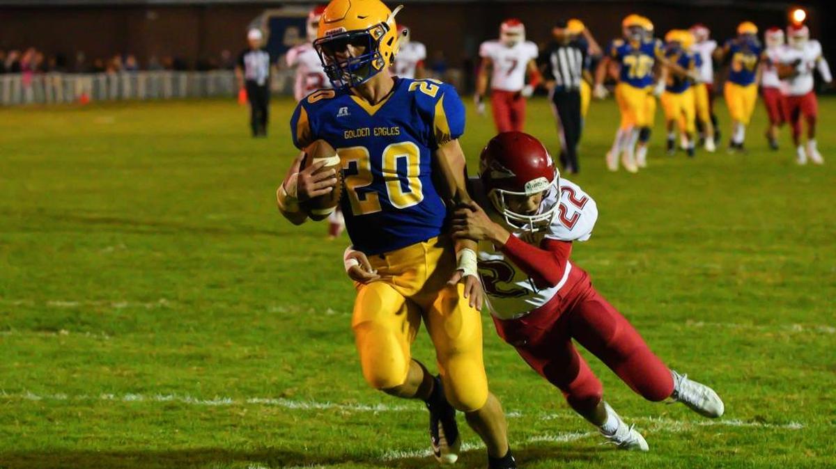 Ferndale’s Ben Broselle runs through a tackle attempt by Marysville-Pilchuck’s Royce Inthathirath Friday, Sept. 30.