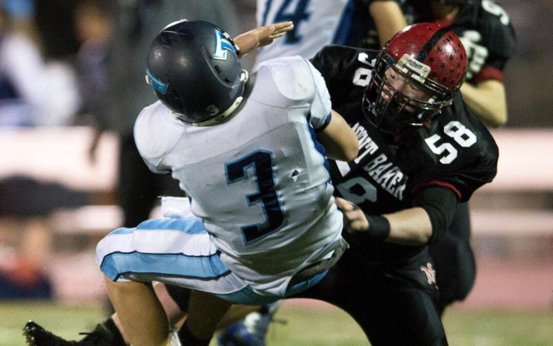 Mount Baker’s Kolton Zender crushes Sultan's Tanner Belcher for a sack on Friday, Nov. 6, at Civic Stadium. The Mountaineers travel to Montesano on Saturday, Nov. 21