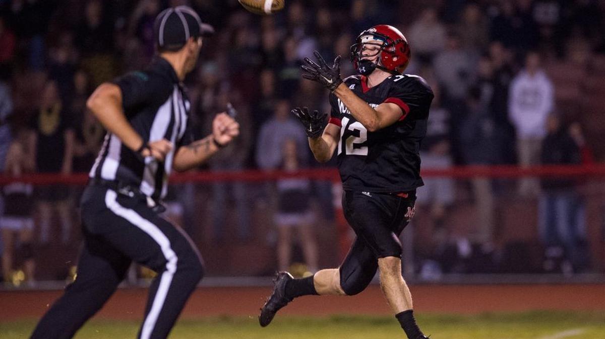 Mount Baker Sophomore Thomas Barbo catches a pass from quarterback Mason Bass in the first quarter against Meridian on Friday, Oct. 23. Mount Baker defeated Meridian 36-15.