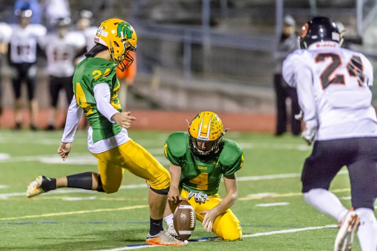 Lynden kicker Marko Samoukovic (24) kicks a field goal during the first quarter of the the 2A Northwest district playoff game at Civic Stadium on Friday, Nov. 2, 2018, in Bellingham.