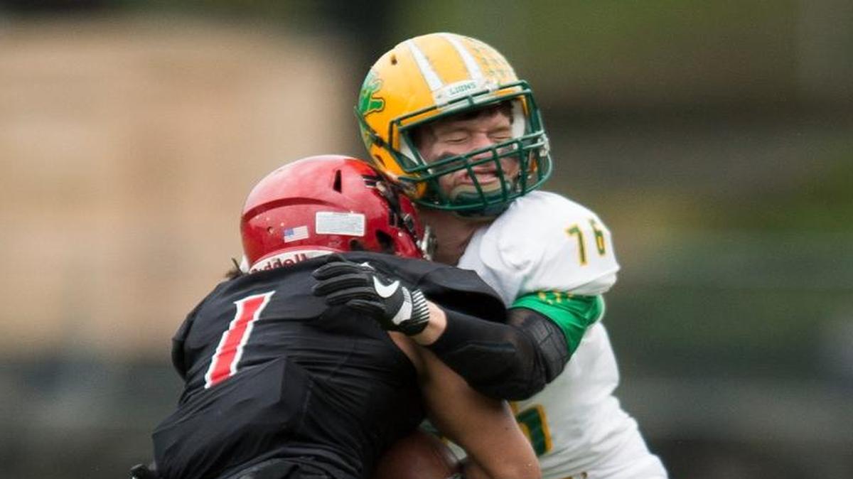 Lynden’s Trey LaBounty, right, makes a tackle during a playoff game against Archbishop Murphy Nov. 26 at Everett Memorial Stadium in Everett.