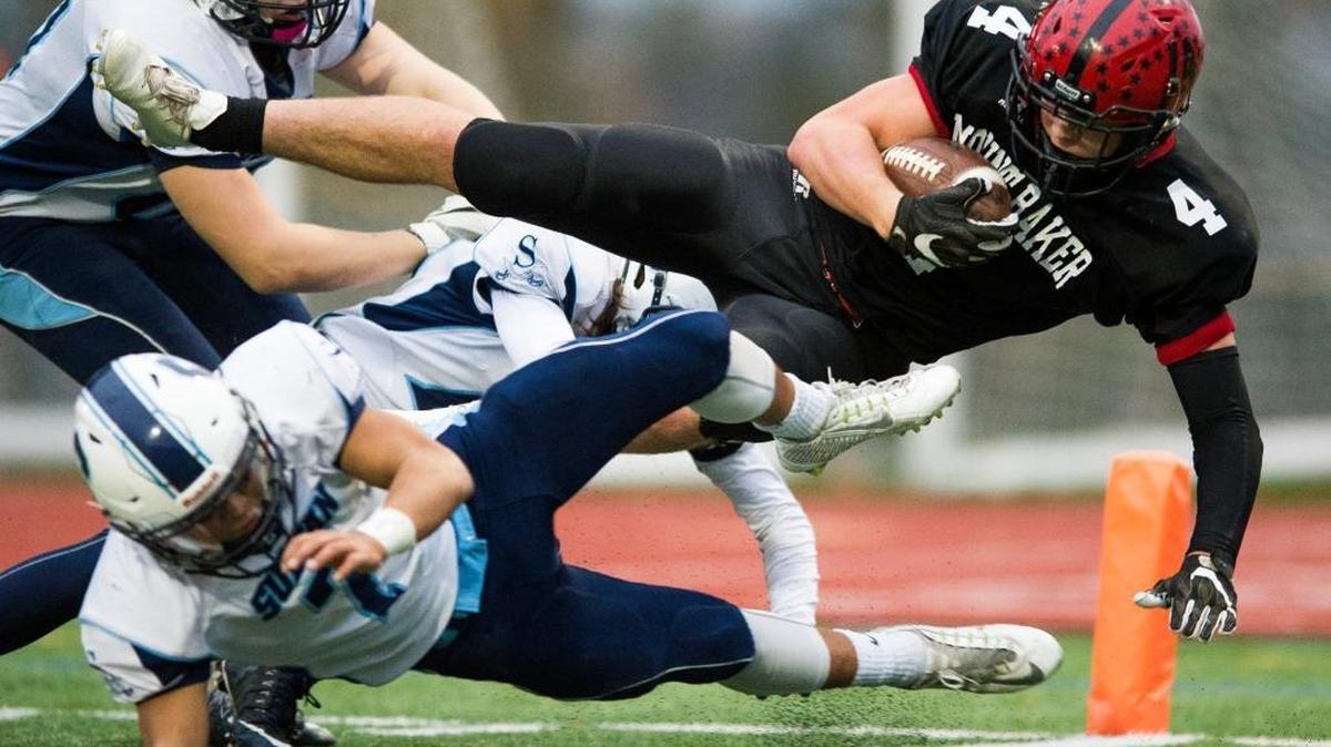 Mount Baker’s Jed Schleimer dives through Sultan defenders into the end zone for a touchdown in a Class 1A Northwest District playoff game Friday, Nov. 4, at Civic Stadium in Bellingham. Mount Baker won 41-0.