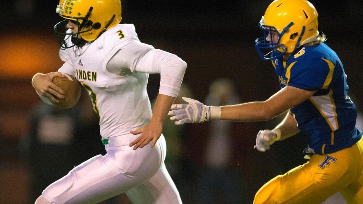 Lynden's Sterling Somers breaks loose from Ferndale defenders on a 37-yard touchdown run on Friday, Oct. 16, at Ferndale.