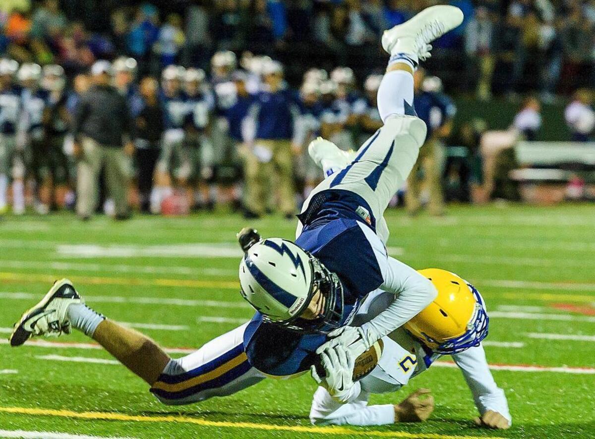Squalicum wide receiver Noah Westerhoff (7) dives for the goal over Ferndale defensive back Sky Freeman late in the first quarter on Saturday evening, Oct. 10, at Civic Stadium in Bellingham. Westerhoff failed to make the touchdown as time in the first quarter ran out. Squalicum failed to capitalize on their position losing the ball on downs during the first minute of the second quarter.