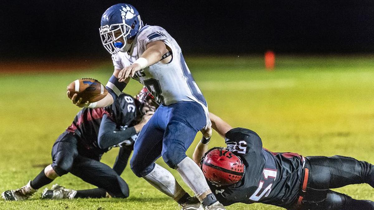 Lynden Christian wide receiver Zach Sipma is stopped by Mount Baker defensive back Davin Beason, right, after a pass reception and short gain during the second quarter on Friday evening, Oct. 18, 2019, on Bob Tisdale Field at Mount Baker High School in Deming, Wash. Lynden Christian defeated Mount Baker 27-8.