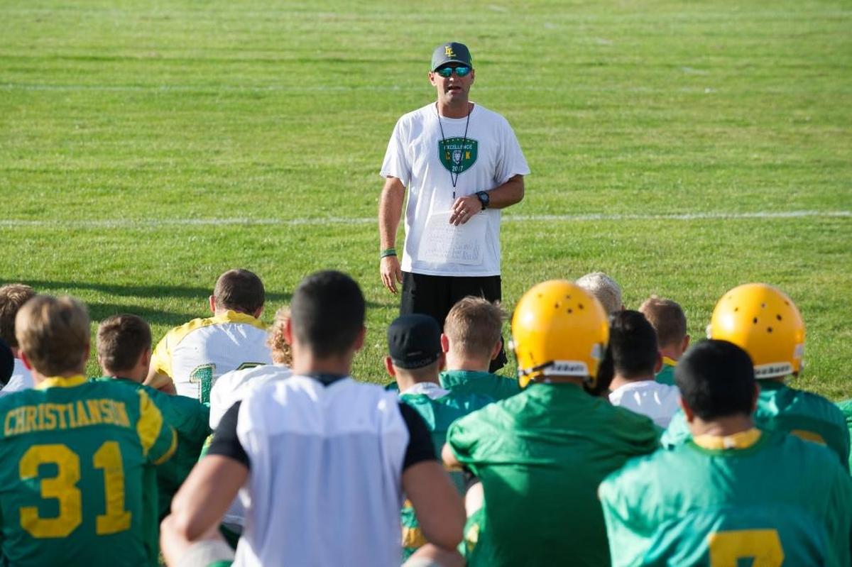 New Lynden head coach Blake VanDalen addresses the football team at the start of the first practice session for the 2017 season Wednesday at Lynden High School.
