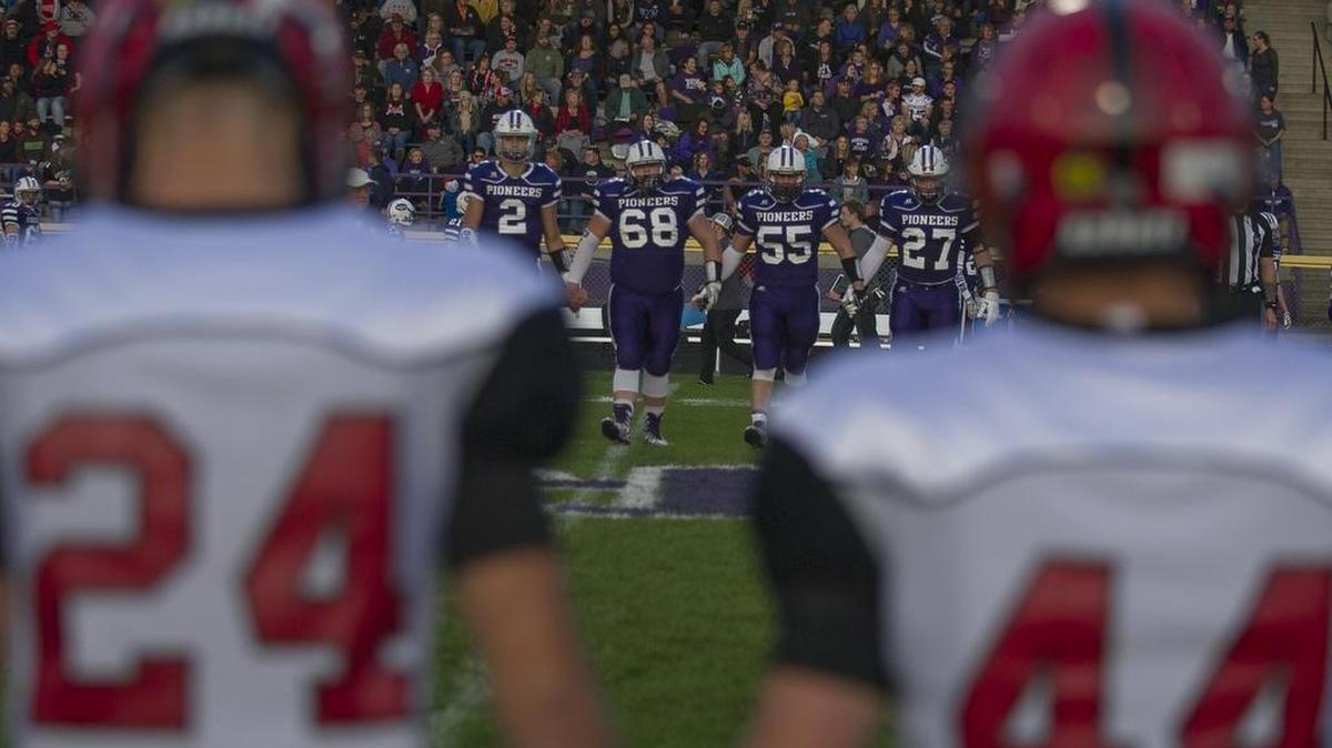 Captains head out to the center of the field for the coin toss before Nooksack Valley’s game against Mount Baker Sept. 22, in Everson. The Pioneers won 26-14.