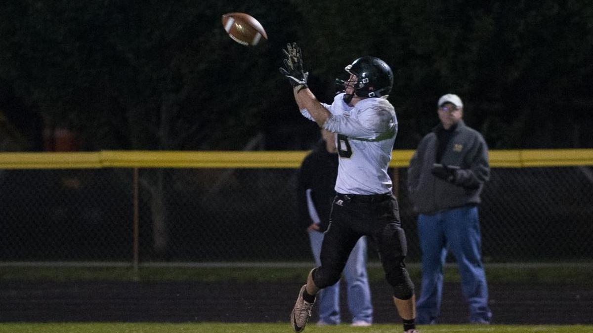 Meridian’s Bryce Vandenhaak catches a touchdown pass in the fourth quarter during a 28-27 victory over Nooksack Valley on Friday, Oct. 20, at Nooksack Valley High School.