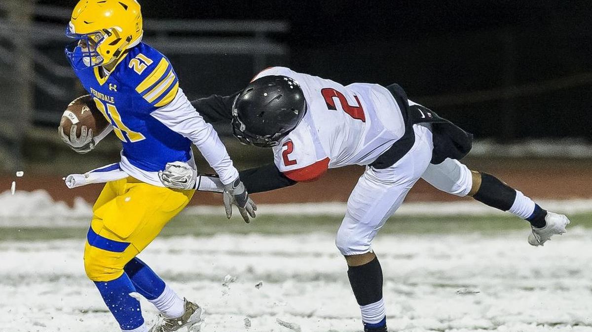 Ballard defensive back Zedekiah Webster attempts to tackle Ferndale running back Cole Semu during the first quarter of the 3A district playoffs Friday at Civic Stadium. The Golden Eagles host Bethel in the first round of the 3A state playoffs this week.
