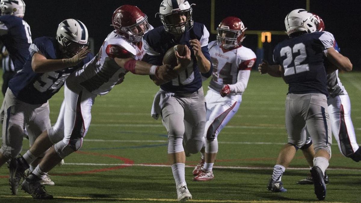 Squalicum’s Spencer Lloyd, center, scores a touchdown against Stanwood on Sept. 23 at Civic Stadium in Bellingham.
