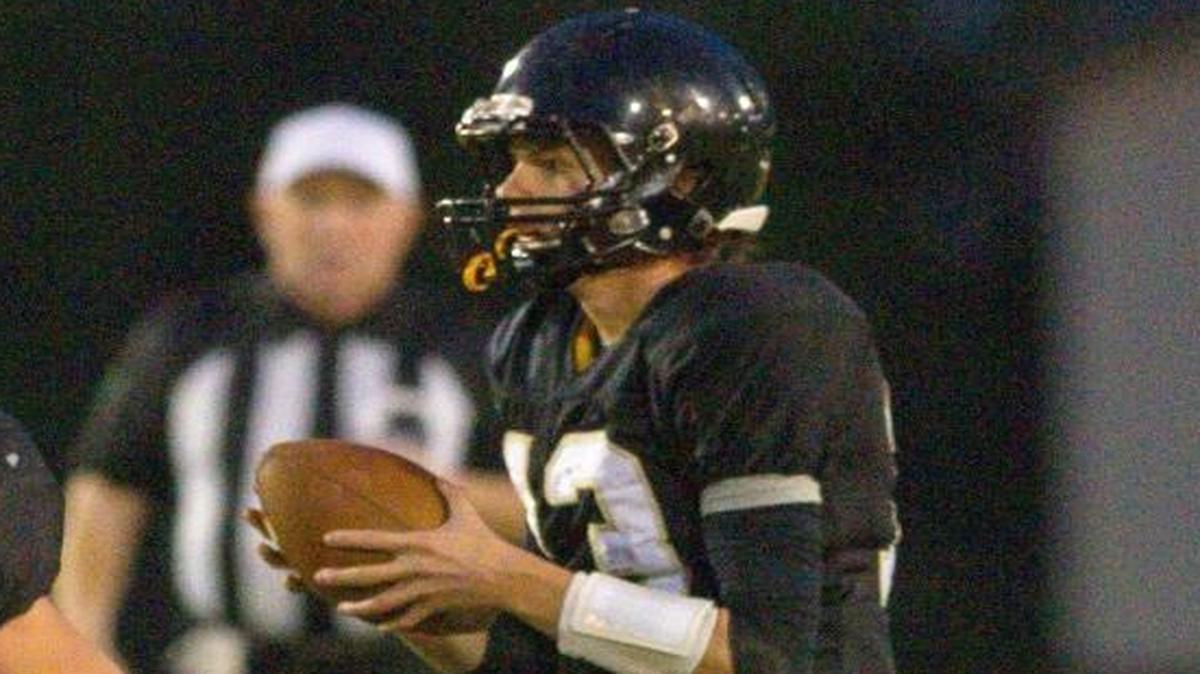 Meridian senior quarterback Simon Burkett, right, announced he plans to play Division I football at Eastern Washington University in 2018.