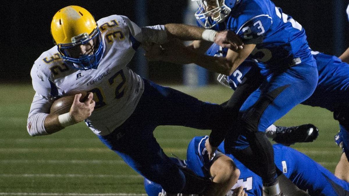Ferndale's Austin Honeycutt drives through a pile of Sedro-Woolley defenders on Thursday, Oct. 29, at Sedro-Woolley High School.
