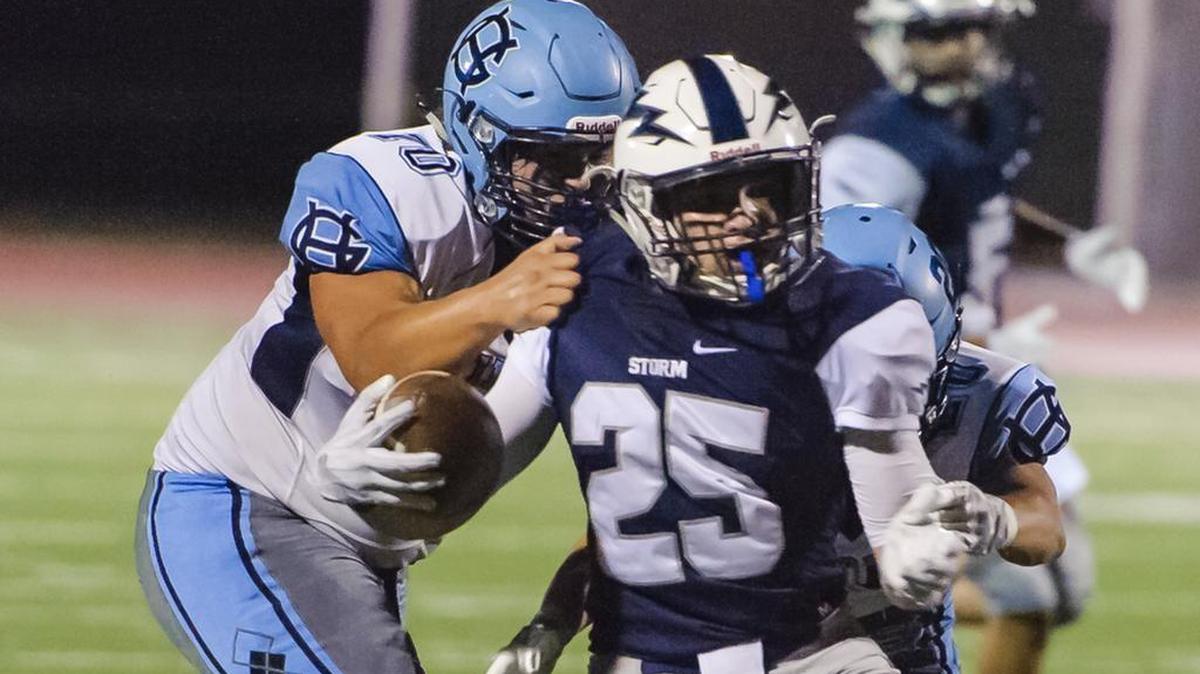 Squalicum’s Triston Smith breaks through a tackle Friday against Gig Harbor. The Storm is ranked No. 6 in Class 3A.