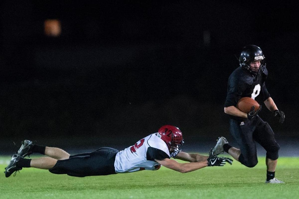 Meridian’s Bryce Vandenhaak, right, avoids a tackle by Mount Baker’s Thomas Barbo Oct. 6. Vandenhaak leads Whatcom County with 853 yards receiving this year.