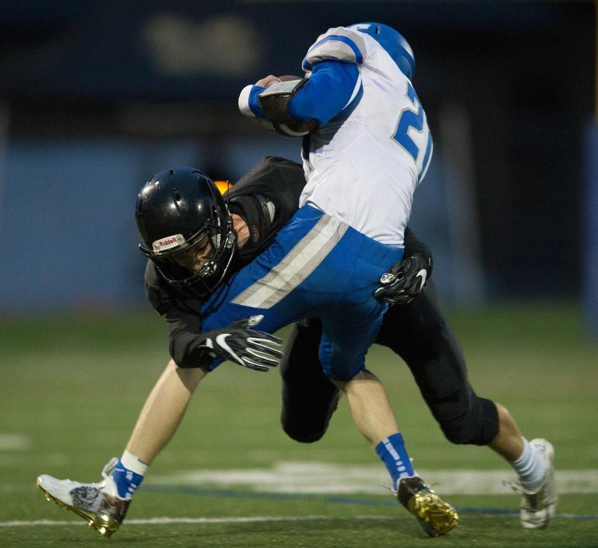 Meridia’'s Lukas Hemenway tackles La Center’s Tanner Dreyer behind the line of scrimmage on Saturday, Nov. 25, at Civic Stadium in Bellingham.