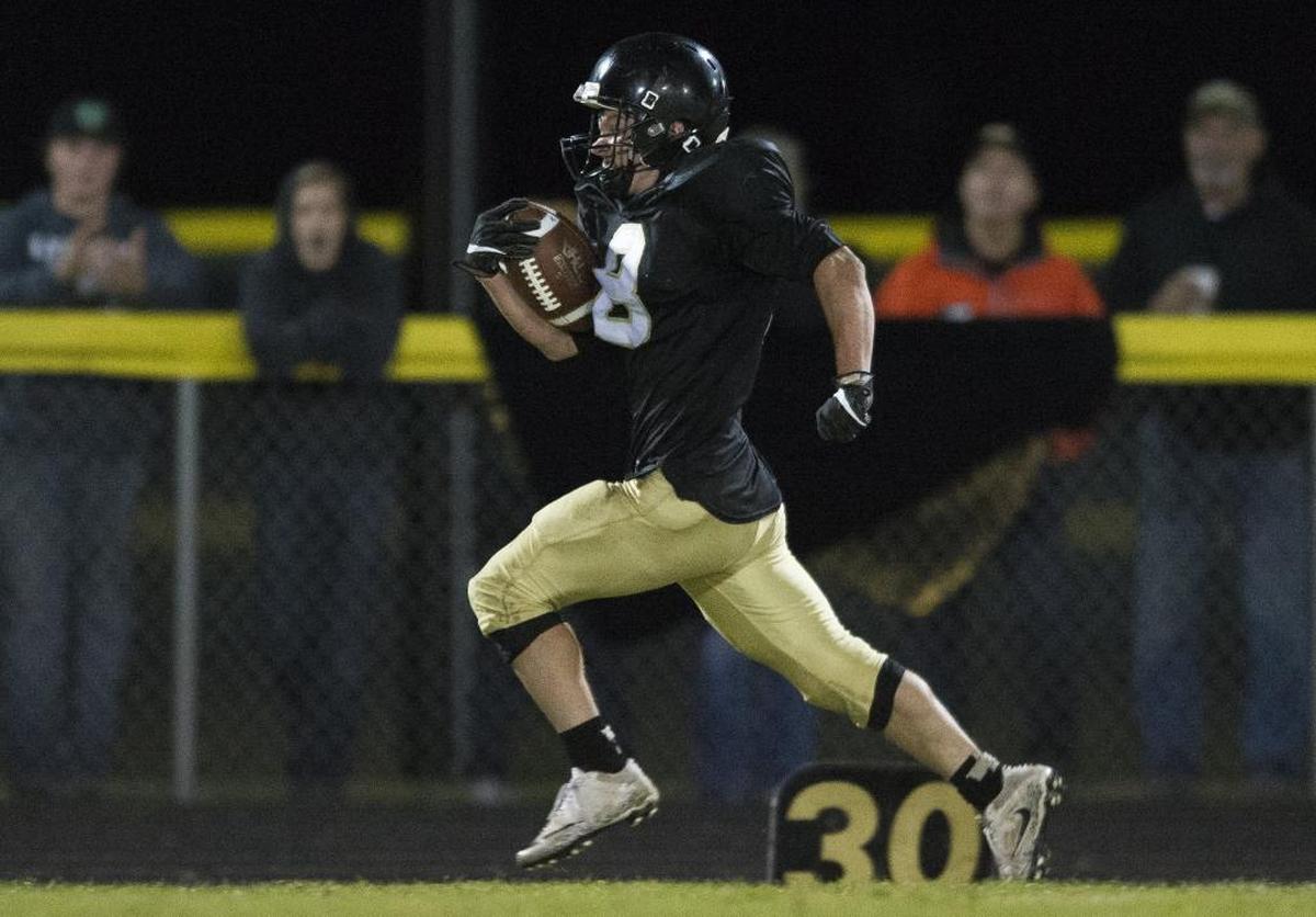 Meridian’s Bryce Vandenhaak takes a short pass against Nooksack Valley Sept. 29. He leads Whatcom County with 1,191 yards receiving this year.