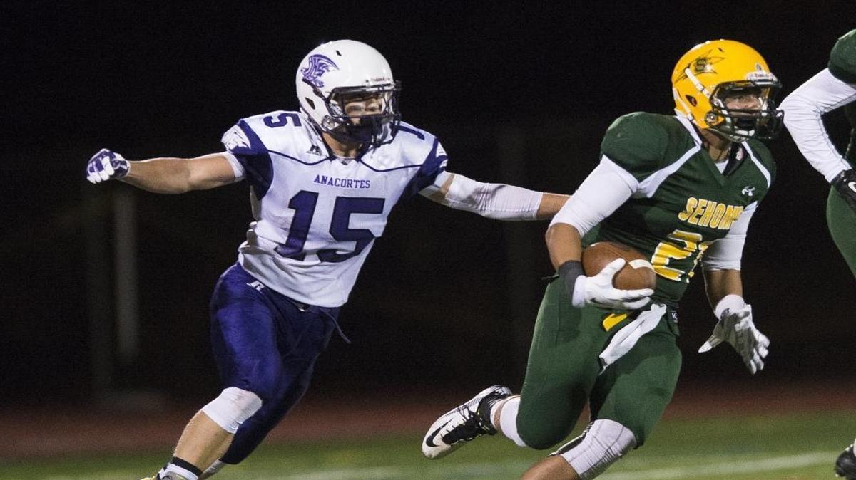 Sehome’s Marcus Montag returns an interception during a 16-3 victory over Anacortes Sept. 19 at Civic Stadium. The Mariners and Seahawks are two of the seven Northwest Conference 2A programs that were surprised by a Cascade Conference vote not to merge the two conferences for football only beginning next season.
