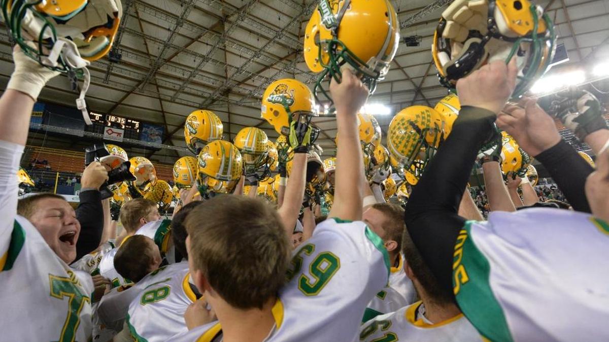Lynden celebrates its 2013 Class 2A state high school championship win over Tumwater at the Tacoma Dome. The WIAA will not hold the semifinals of the football playoffs at the Tacoma Dome next year and is considering other options for its state championship games.