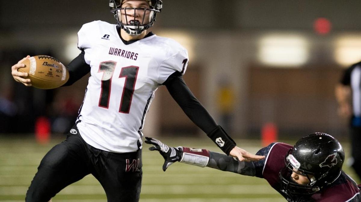 Almira/Coulee-Hartline/s Dallas Isaak knocks away the outstretched arm of Lummi’s Raven Borsey during the Class 1B State Championship Game on Friday, Dec. 4, at the Tacome Dome.