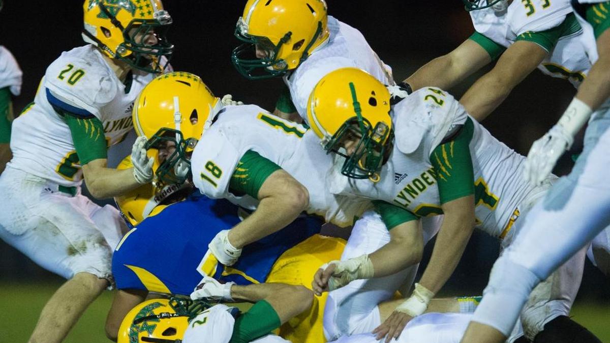 A group of Lynden tacklers including Ben Colwell (18), Nui Labat-Alconcel (24), Grant Scarlett (27) and Conner Shine (20) bring down a Ferndale player during a 34-7 win over the Golden Eagles on Friday, Oct. 16, at Ferndale High School.
