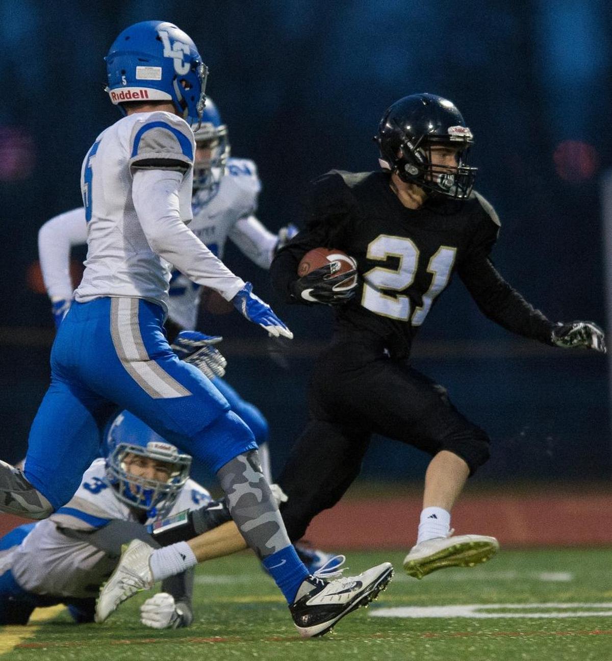 Meridian’s Lukas Hemenway breaks through the La Center defense on his way to a touchdown on Saturday, Nov. 25, at Civic Stadium in Bellingham.