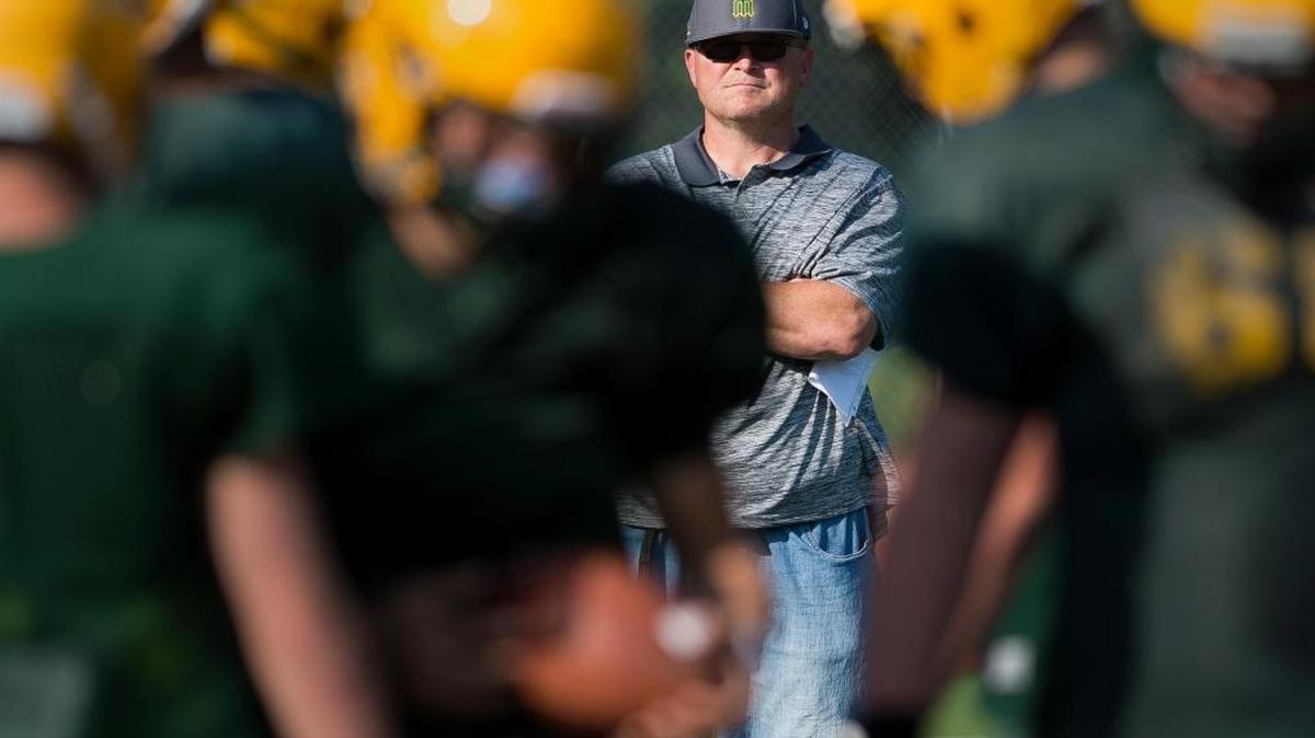 Kevin Beason, new head football coach at Sehome High School, watches the team’s defense practice Aug. 29 at Western Washington University.