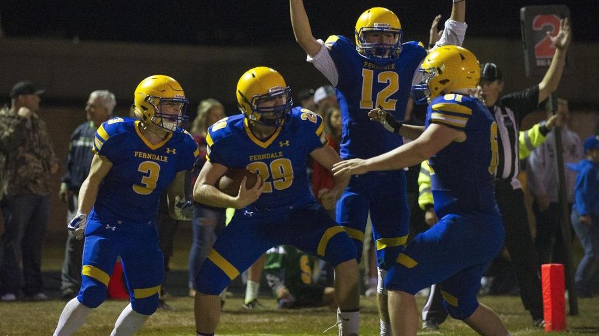 Ferndale’s Gader Fox, center left, celebrates with teammates Conner Obergottsberger, left, Jared Emmert, center right, and Spencer Crosswhite, right, after catching the game-winning touchdown pass Sept. 8 against Lynden. The Golden Eagles are ranked No. 2 in the latest Class 3A state rankings.