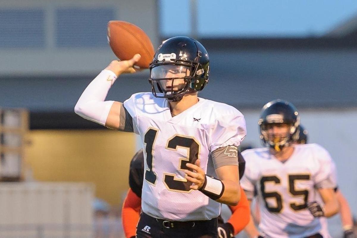 Meridian quarterback Simon Burkett looks for an open receiver Sept. 8. Burkett leads Whatcom County with 2,847 yards passing this season.