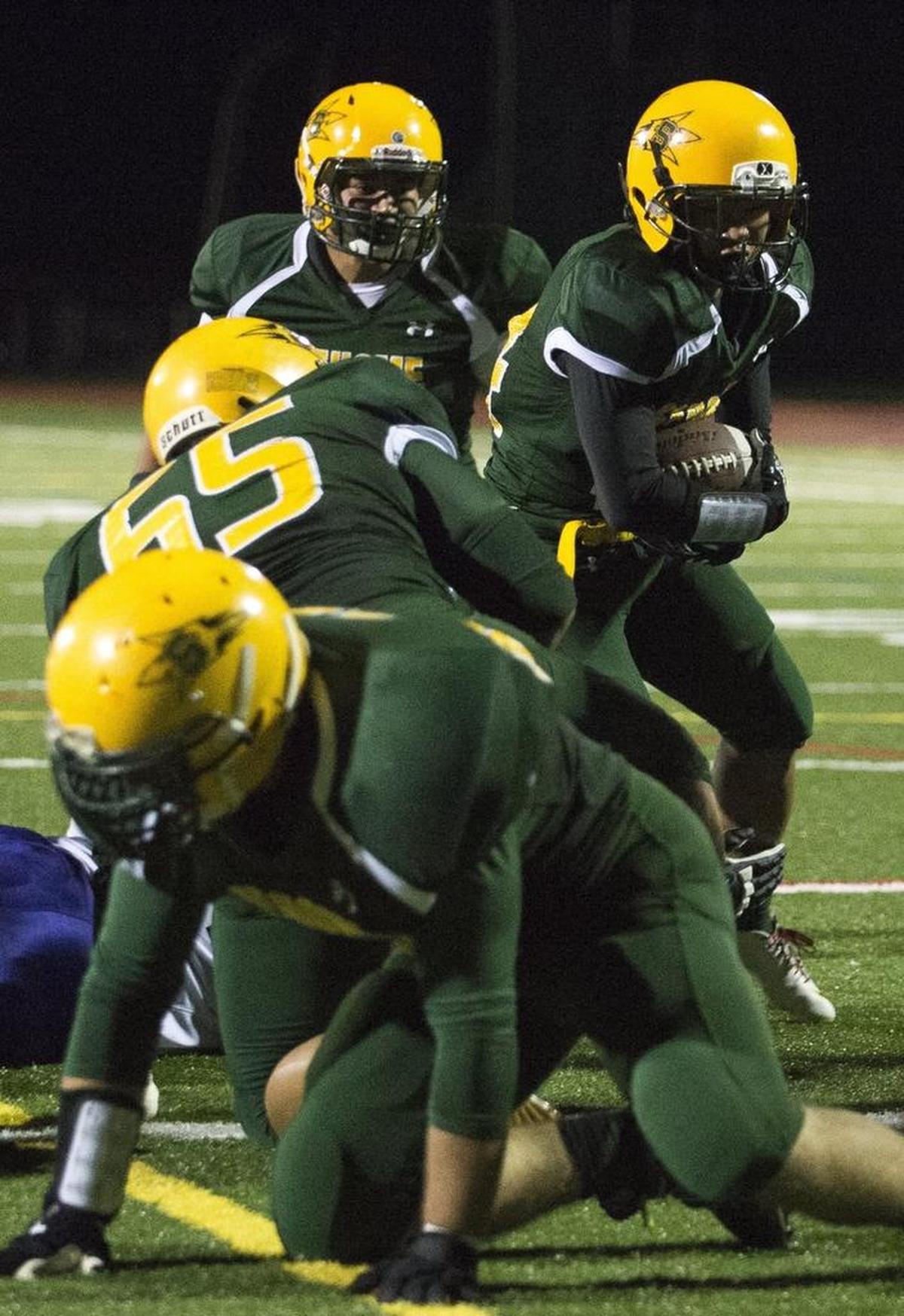 Sehome’s Kevin Sun, right, rushes for a touchdown on Sept. 19, at Civic Stadium.