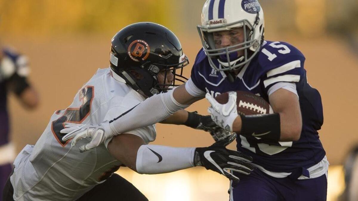 Austin O’Bryan looks to pick up yardage against Blaine Sept. 1 at Nooksack Valley.