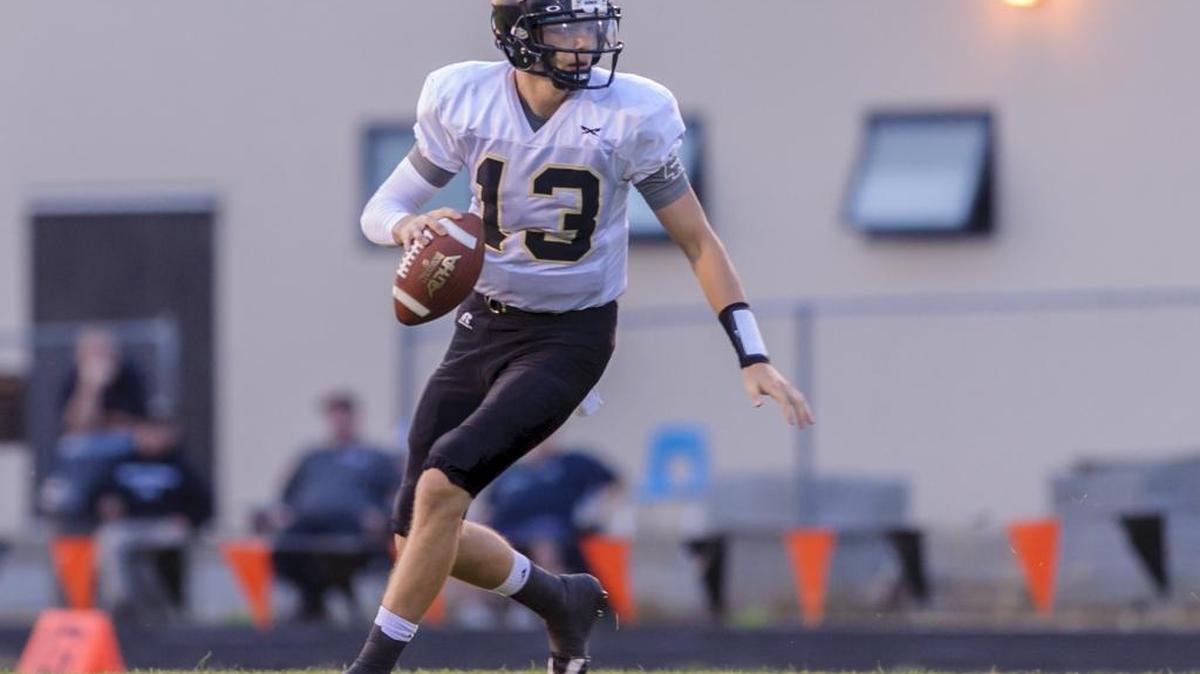 Meridian quarter back Simon Burkett looks for an open man during the first quarter on Friday at Blaine.