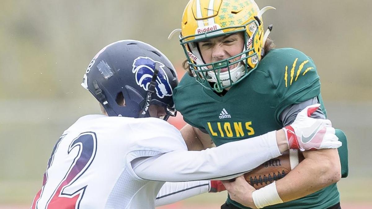 Black Hills’ Lucas Johnson attempts to wrap up Lynden’s Jacob Hommes during the Class 2A first round state playoff game Saturday at Civic Stadium in Bellingham. Lynden faces Spokane West Valley in the 2A state quarterfinals Saturday at Gonzaga Prep.