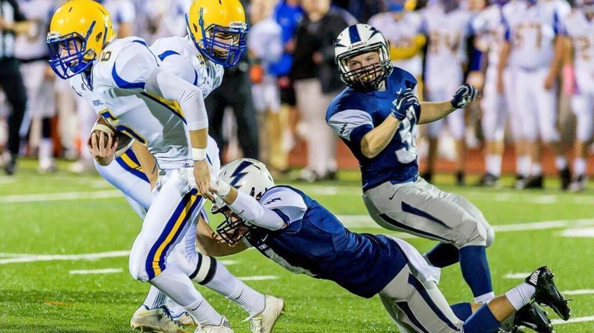 
Squalicum defensive back LeAndrew Alarcon (4), right, takes down Ferndale’s Jacob Kildall (6) for no gain during the first quarter on Saturday evening, Oct. 10, at Civic Stadium in Bellingham, Wash.
