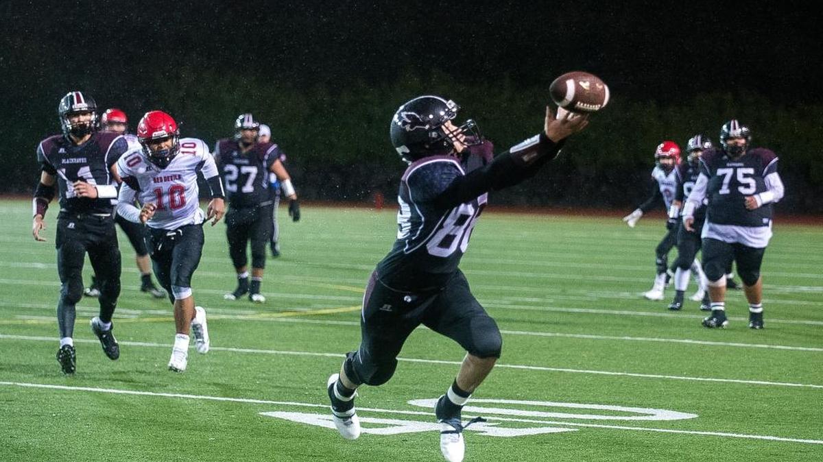 The ball sails just over the hands of Lummi’s Chance Poasa before falling incomplete on a critical fourth-down play in the fourth quarter against Neah Bay on Saturday, Nov. 26, at Everett Memorial Stadium.