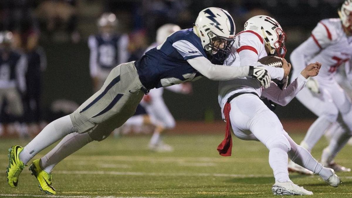 Squalicum’s Carsdan Dvorachek sacks Panthers quarterback Langdon Orgill on Saturday in Bellingham, Washington. Squalicum defeated Snohomish 21-13 in a non-league matchup.
