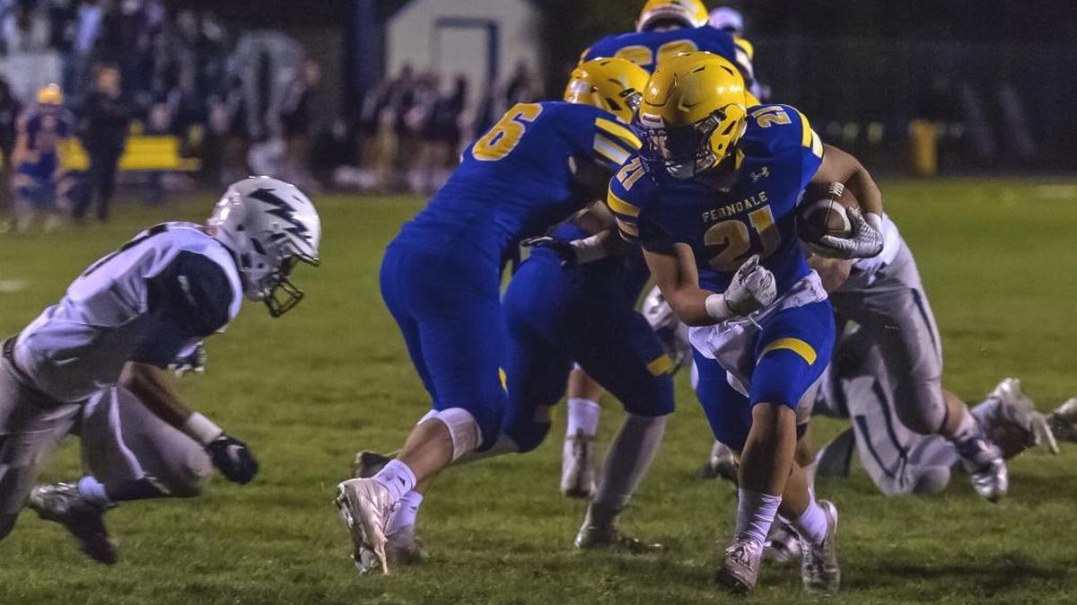 Ferndale running back Cole Semu breaks the line of scrimmage for a big gain Oct. 20 against Squalicum.
