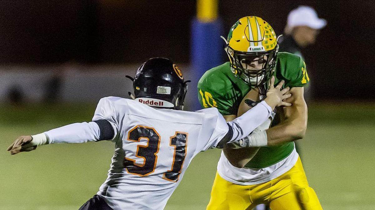 Blaine’s Seth Blomeen, left, attempts to stop Lynden quarterback James Marsh as Marsh runs for the goal line during the second quarter of a 2A Northwest district playoff game at Civic Stadium on Friday evening, Nov. 2, 2018, in Bellingham, Wash. Marsh ran for 10 yards, making a first down on the play. Lynden shut out Blaine 47-0 to advance in the state playoffs.