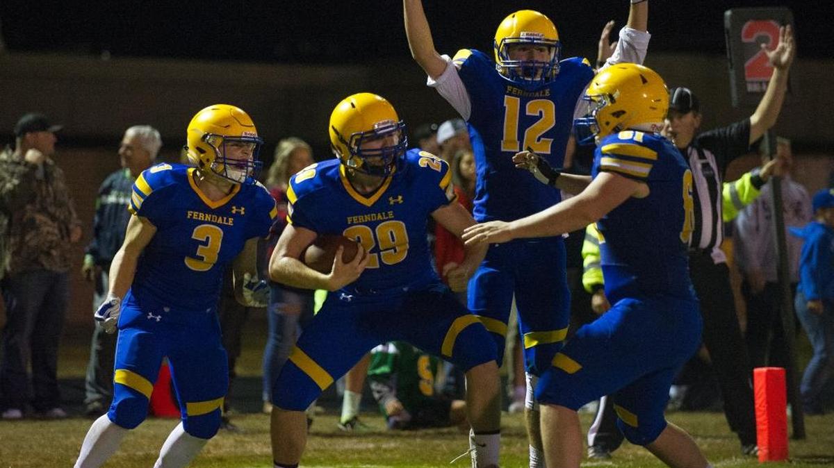 Ferndale's Gader Fox (29) celebrates with Conner Obergottsberger (3) Jared Emmert (12) and Spencer Crosswhite after scoring the game-winning TD.