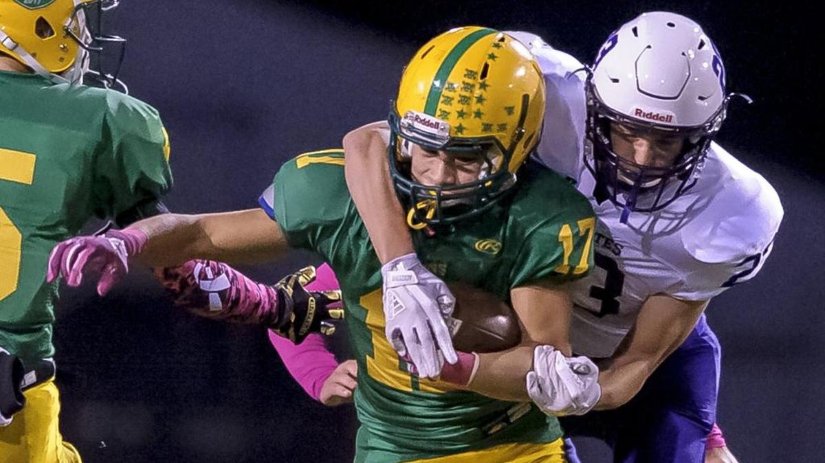 Anacortes’s Nick Heubel tries to tackle Lynden running back Eric Martin-Mann in an Oct. 13 game.