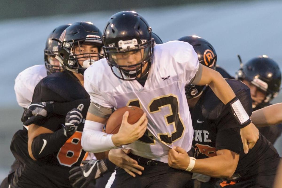 Meridian quarterback Simon Burkett is known as much for his abilities to run the ball as he is for his accurate passes. He’s committed to play for Eastern Washington next fall.